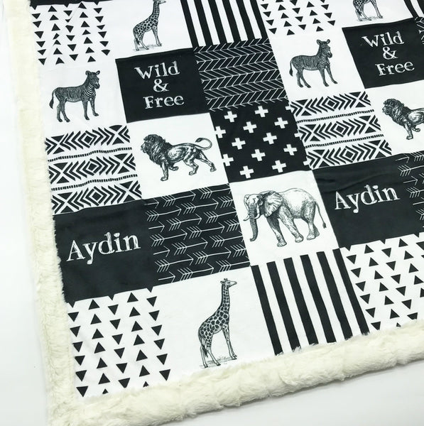 JOOMOOKIE SAFAR Patchwork Minky Blanket with Zebra, Lion, Giraffe, & Elephant in Black & White